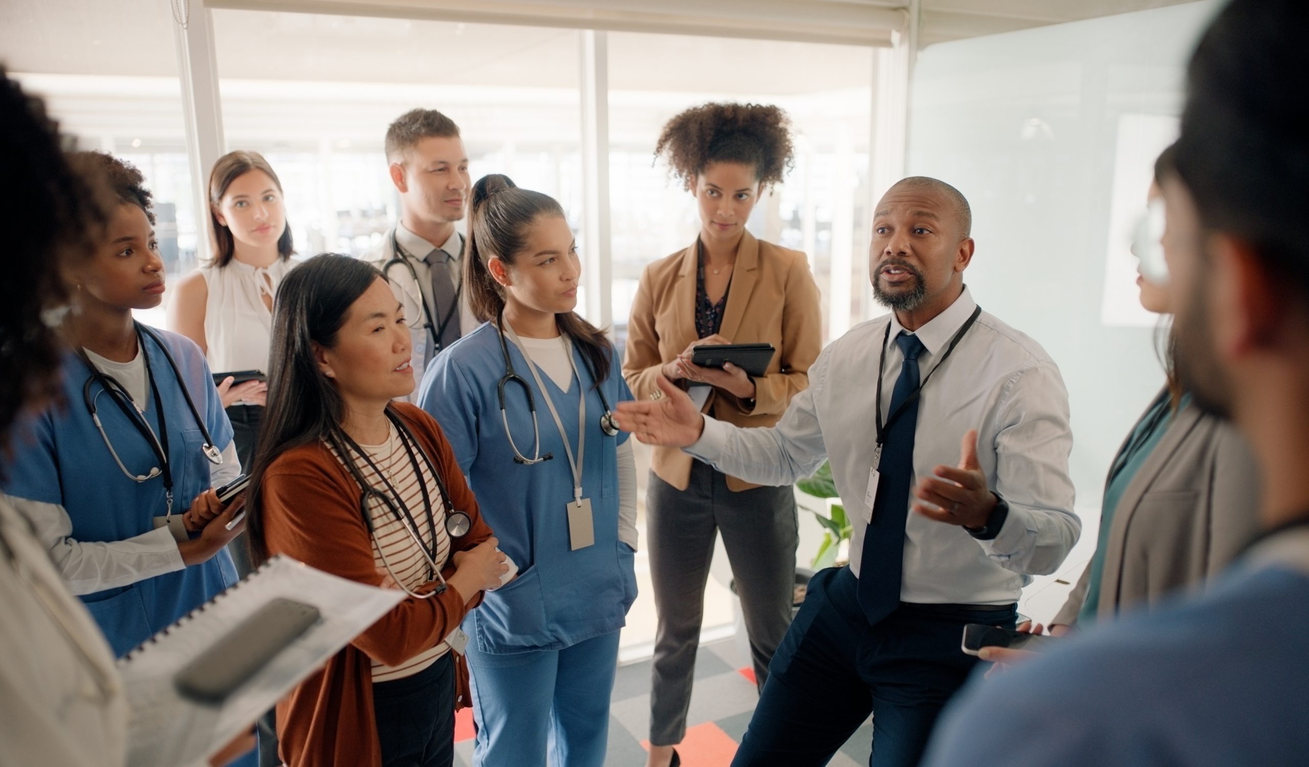 Healthcare leadership team discussing third-party liability recovery strategy
